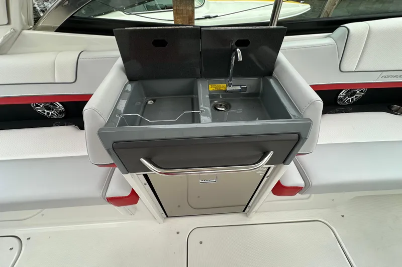  Yacht Photos Pics 2024 Formula 330 CBR boat interior with sink and seating area.