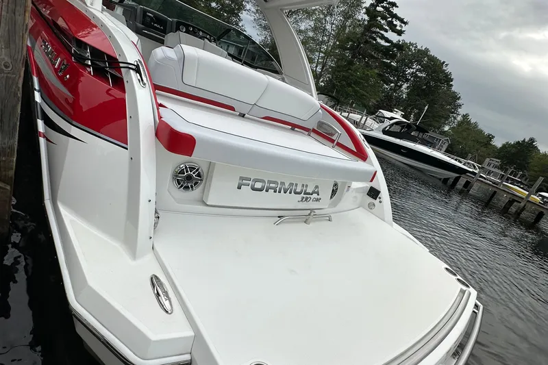  Yacht Photos Pics 2024 Formula 330 CBR boat docked, featuring sleek red and white design.