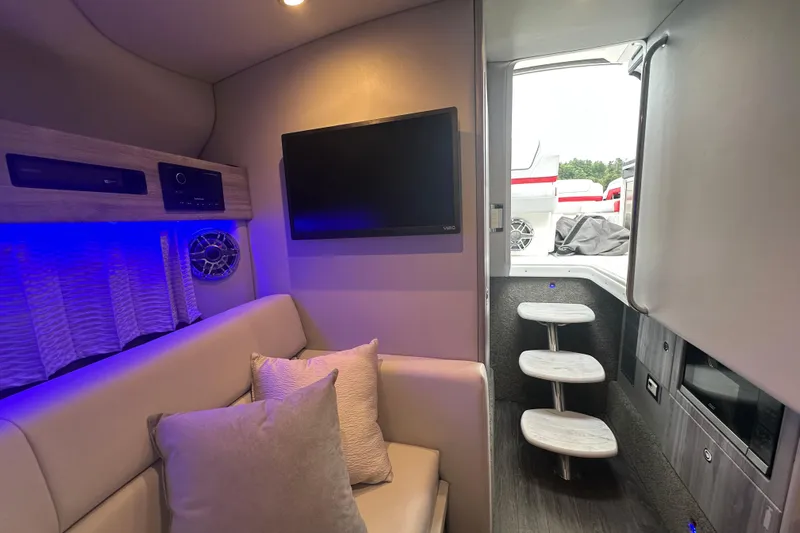  Yacht Photos Pics 2024 Formula 330 CBR interior with modern seating, TV, and ambient lighting.
