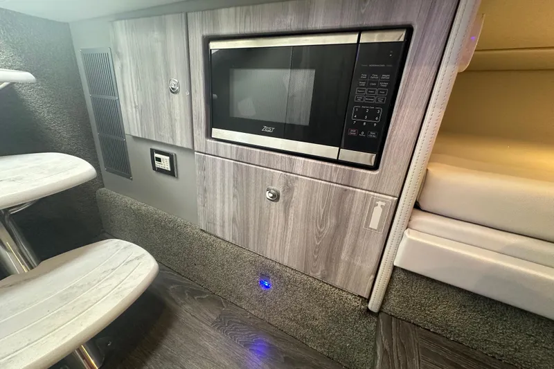  Yacht Photos Pics 2024 Formula 330 CBR interior with microwave and modern cabinetry.