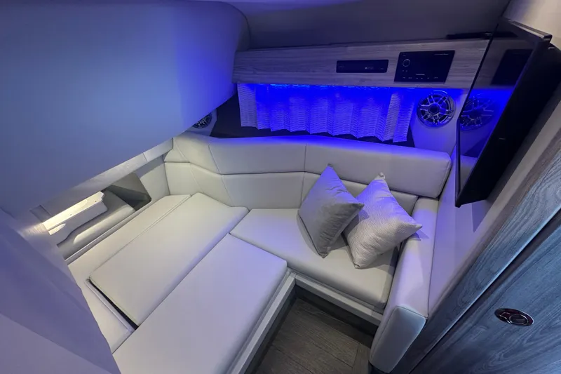 Yacht Photos Pics Luxurious interior of 2024 Formula 330 CBR boat with modern seating and ambient lighting.