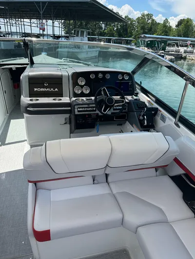  Yacht Photos Pics 2024 Formula 330 Crossover Bowrider I/O interior with helm and seating area.