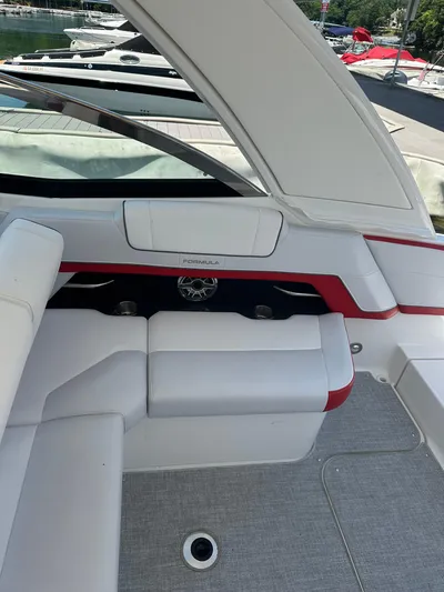  Yacht Photos Pics 2024 Formula 330 Crossover Bowrider I/O interior with white seating and red accents.