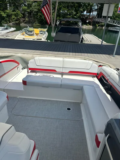  Yacht Photos Pics 2024 Formula 330 Crossover Bowrider I/O with spacious seating at a marina dock.
