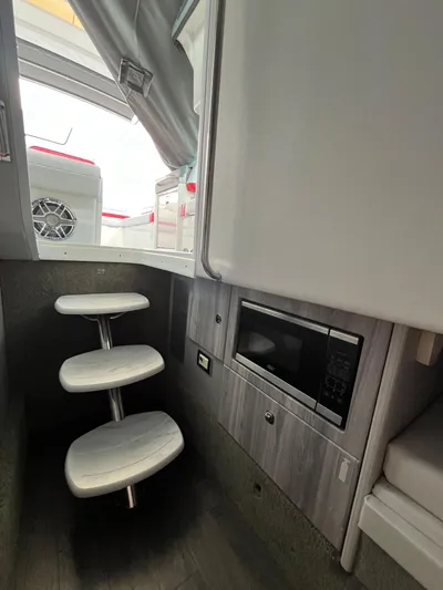  Yacht Photos Pics 2024 Formula 330 Crossover Bowrider I/O interior with steps and microwave.