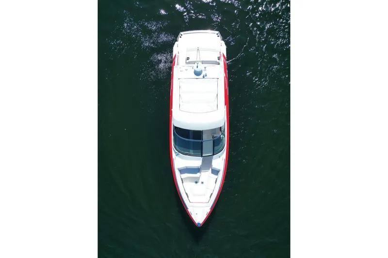 Yacht Photos Pics 2024 Formula 330 Crossover Bowrider, aerial view on water, sleek design.