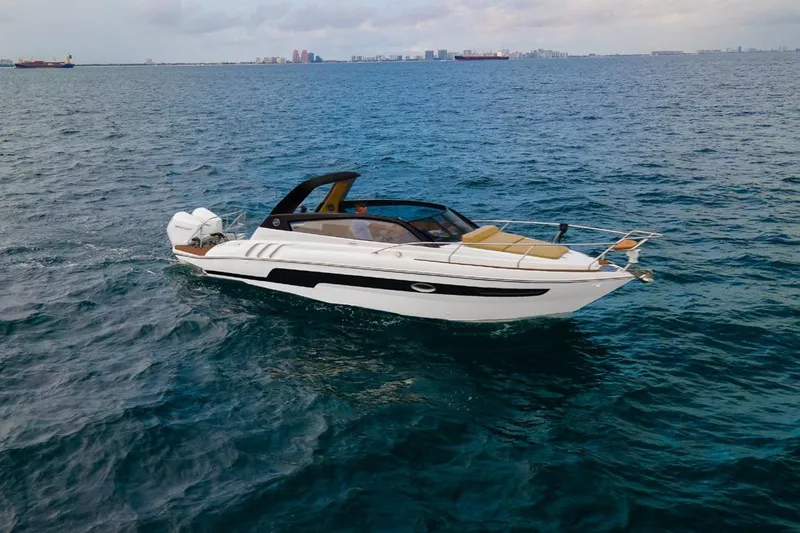  Yacht Photos Pics 2024 Hanover 305 White & Black Edition boat cruising on open water.