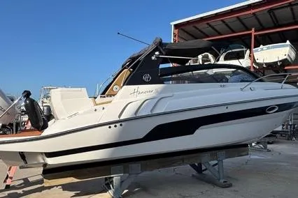  Yacht Photos Pics 2024 Hanover 305 White & Black Edition boat on display in a marina setting.