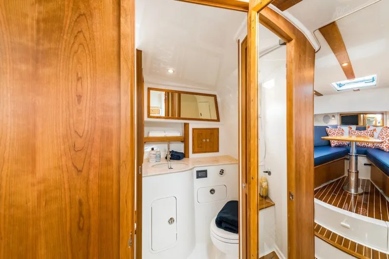  Yacht Photos Pics Manufacturer Provided Image: 2023 Hinckley Sport Boats 40x interior bathroom with wooden finishes and modern amenities.