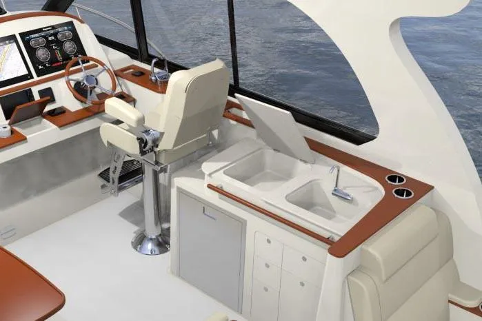  Yacht Photos Pics Manufacturer Provided Image: 2023 Hinckley Sport Boats 40x interior with helm, sink, and seating area.