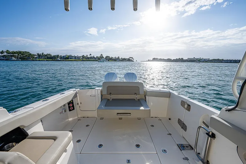  Yacht Photos Pics 2021 Boston Whaler 280 Vantage boat interior with ocean view and sunny sky.