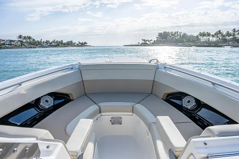  Yacht Photos Pics 2021 Boston Whaler 280 Vantage boat interior with ocean view and seating area.