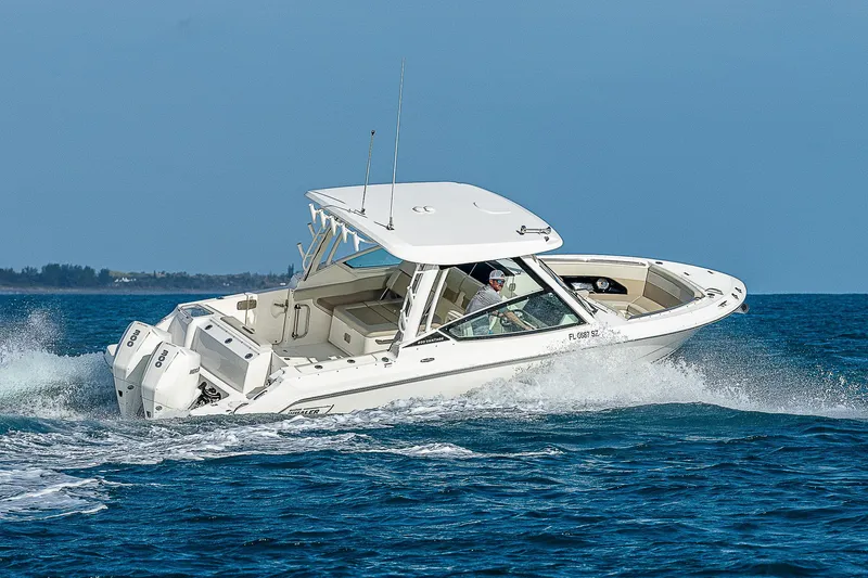  Yacht Photos Pics 2021 Boston Whaler 280 Vantage cruising on open water.