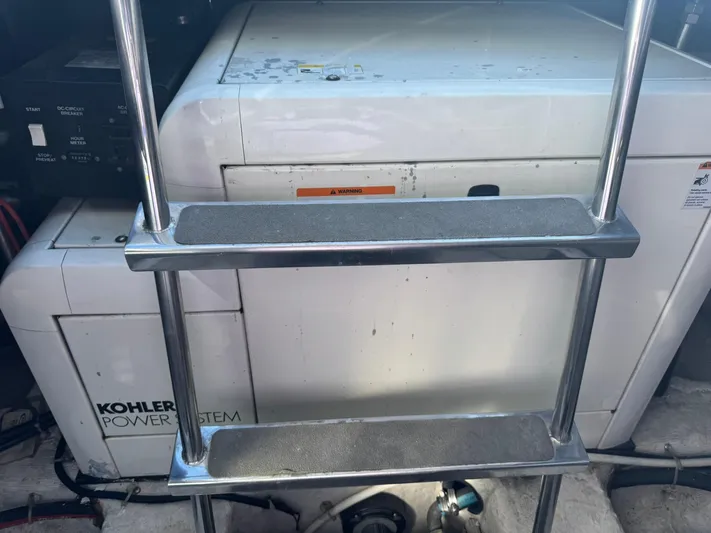  Yacht Photos Pics Engine room of 2001 Carver 450 Voyager Pilothouse with Kohler power system and ladder.