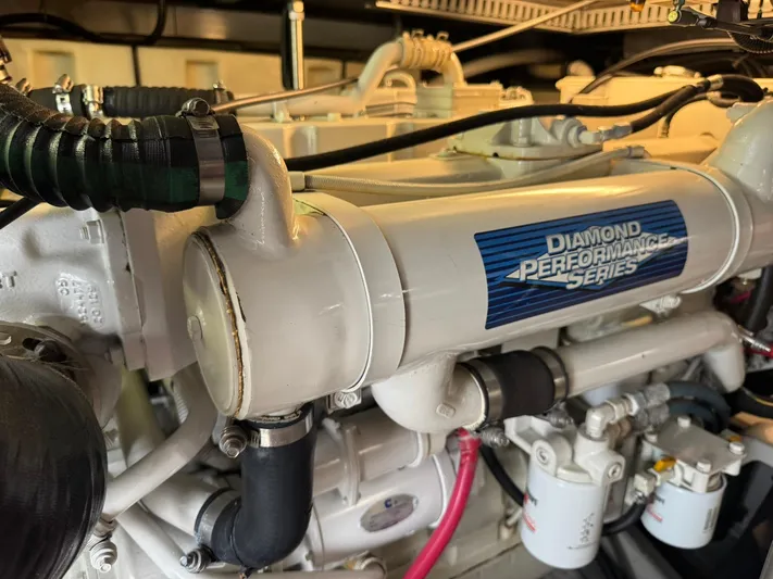  Yacht Photos Pics Engine of 2001 Carver 450 Voyager Pilothouse, Diamond Performance Series label visible.