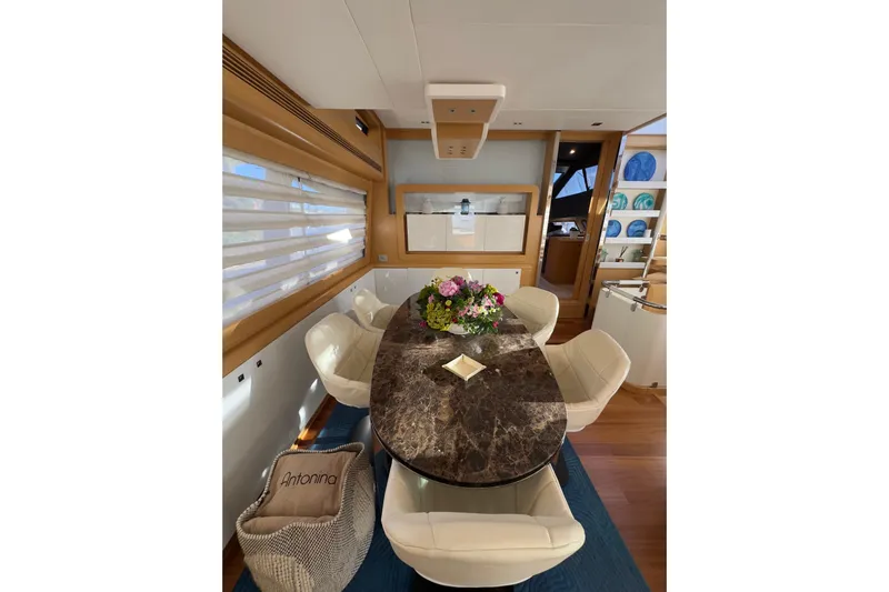  Yacht Photos Pics Luxurious dining area on 2010 Ferretti Yachts 800 with elegant decor and marble table.