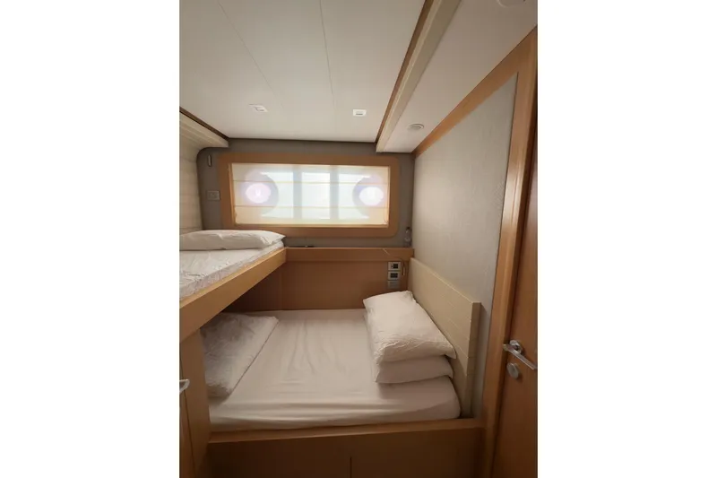  Yacht Photos Pics Cozy cabin with bunk beds in 2010 Ferretti Yachts 800, featuring modern wood paneling.
