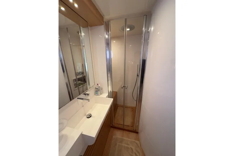  Yacht Photos Pics Luxurious bathroom in 2010 Ferretti Yachts 800, featuring sleek shower and modern sink.