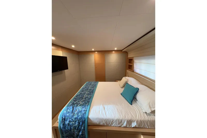  Yacht Photos Pics Luxurious bedroom interior of 2010 Ferretti Yachts 800 with modern decor and cozy bedding.