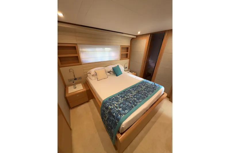  Yacht Photos Pics Luxurious bedroom interior of 2010 Ferretti Yachts 800, featuring elegant bedding and modern design.