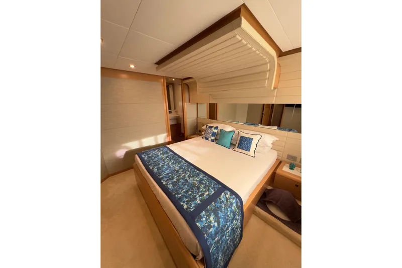  Yacht Photos Pics Luxurious bedroom interior of 2010 Ferretti Yachts 800 with elegant bedding and modern design.