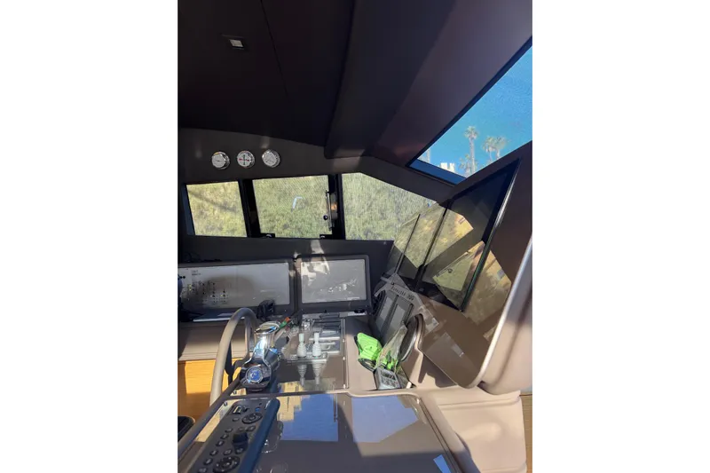  Yacht Photos Pics Interior helm of 2010 Ferretti Yachts 800 with modern navigation equipment.