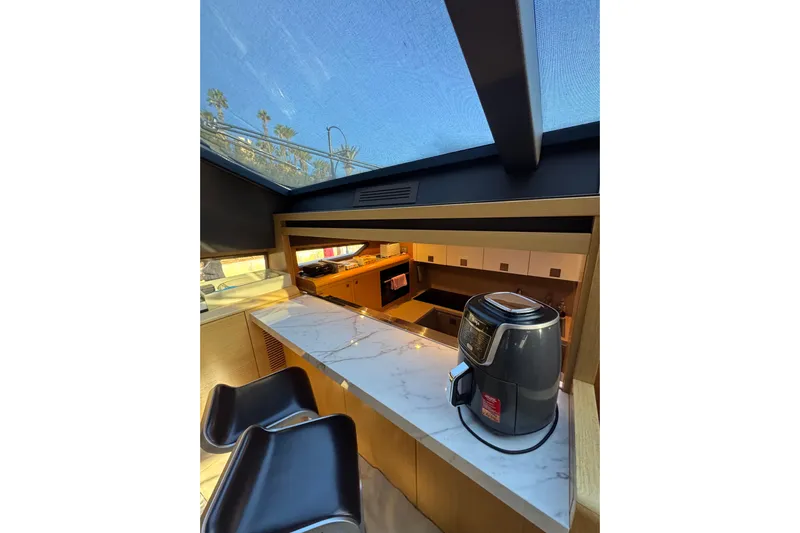  Yacht Photos Pics Luxurious kitchen interior of 2010 Ferretti Yachts 800 with marble countertop and modern appliances.