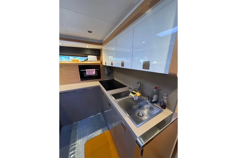  Yacht Photos Pics Modern kitchen in a 2010 Ferretti Yachts 800, featuring sleek cabinetry and stainless steel sink.