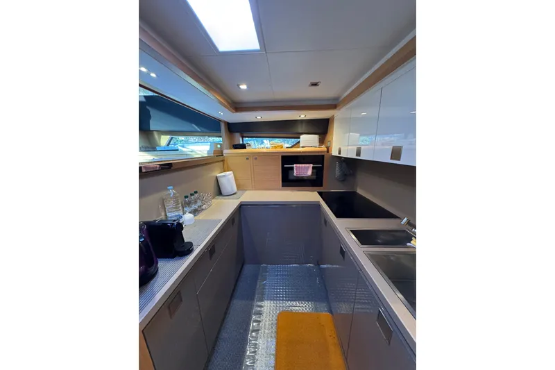 Yacht Photos Pics Modern kitchen interior on 2010 Ferretti Yachts 800, featuring sleek cabinetry and appliances.