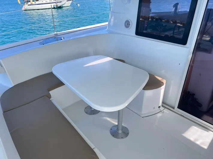 Knotty Nature Yacht Photos Pics Outdoor seating area on a 2011 Fountaine Pajot Lipari 41 catamaran.