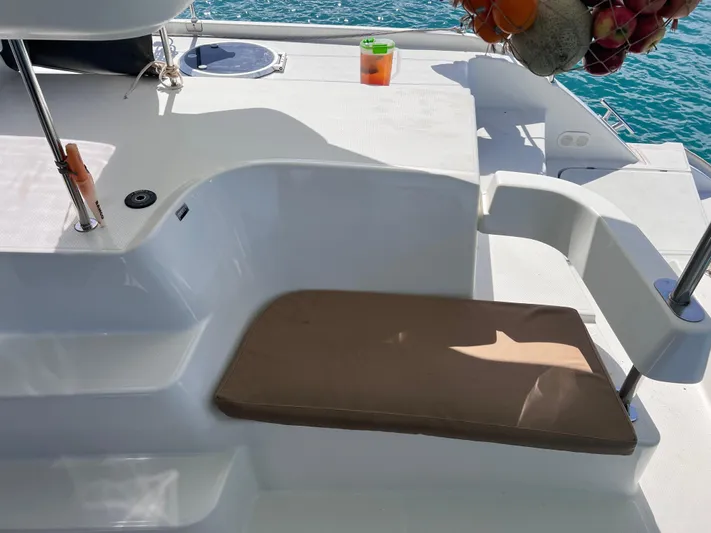 Knotty Nature Yacht Photos Pics Fountaine Pajot Lipari 41 catamaran deck with seating, 2011 model, sunny day.