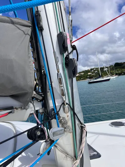 Knotty Nature Yacht Photos Pics Close-up of 2011 Fountaine Pajot Lipari 41 sailboat rigging with scenic ocean backdrop.