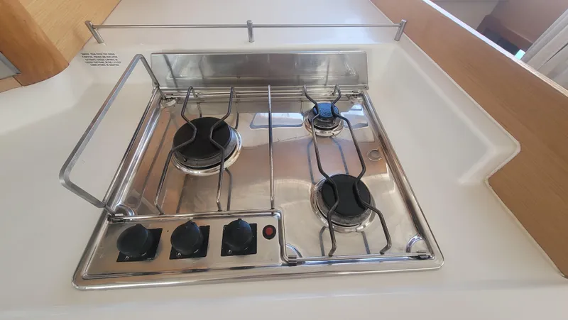 Knotty Nature Yacht Photos Pics Stainless steel stove in 2011 Fountaine Pajot Lipari 41 catamaran kitchen.
