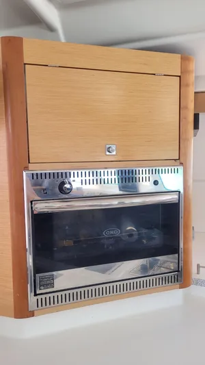 Knotty Nature Yacht Photos Pics Wooden cabinet with built-in oven on 2011 Fountaine Pajot Lipari 41 yacht.