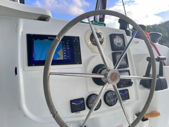 Knotty Nature Yacht Photos Pics Steering wheel and navigation panel of 2011 Fountaine Pajot Lipari 41 catamaran.