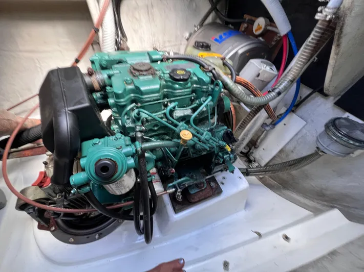 Knotty Nature Yacht Photos Pics Engine compartment of 2011 Fountaine Pajot Lipari 41 catamaran, showcasing mechanical components.