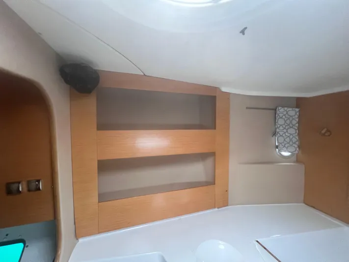 Knotty Nature Yacht Photos Pics Interior of 2011 Fountaine Pajot Lipari 41 catamaran with wooden shelves and modern design.