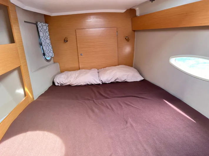 Knotty Nature Yacht Photos Pics Cozy cabin interior of 2011 Fountaine Pajot Lipari 41 catamaran with double bed.