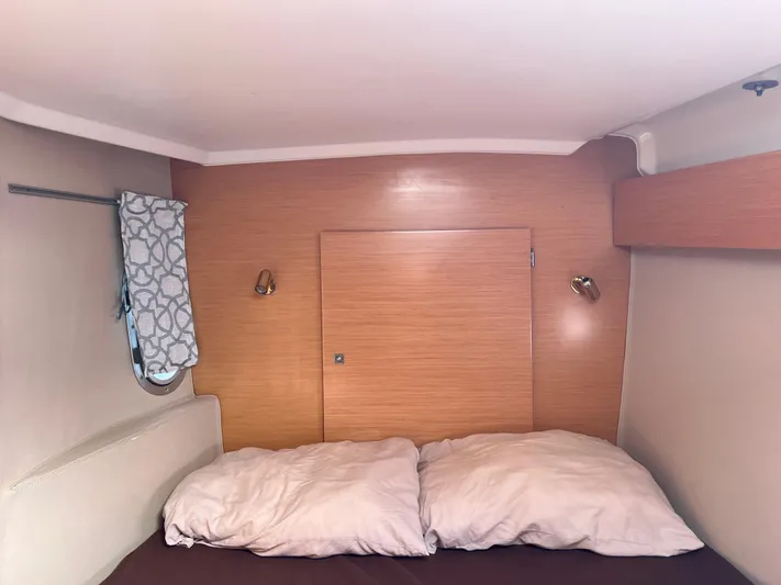 Knotty Nature Yacht Photos Pics Cozy cabin interior of 2011 Fountaine Pajot Lipari 41 catamaran with double bed.