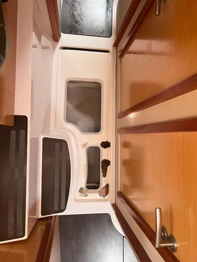 Knotty Nature Yacht Photos Pics Interior of 2011 Fountaine Pajot Lipari 41 catamaran with wooden finishes and steps.