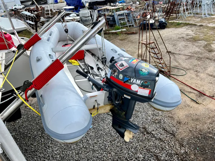 Sunbear Yacht Photos Pics Inflatable boat with Yamaha motor, attached to Lagoon 420, 2008 model, in a boatyard.