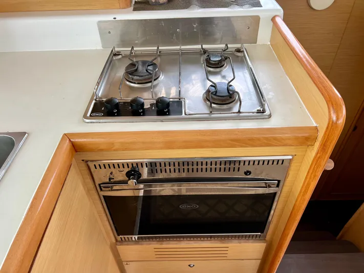 Sunbear Yacht Photos Pics Kitchen area of a 2008 Lagoon 420 yacht with stove and oven.