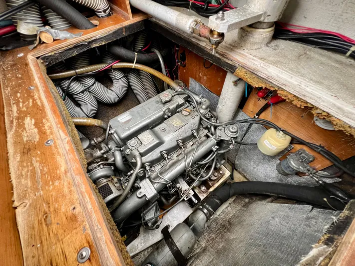 Sunbear Yacht Photos Pics Engine compartment of a 2008 Lagoon 420 sailboat, showcasing mechanical components and wiring.