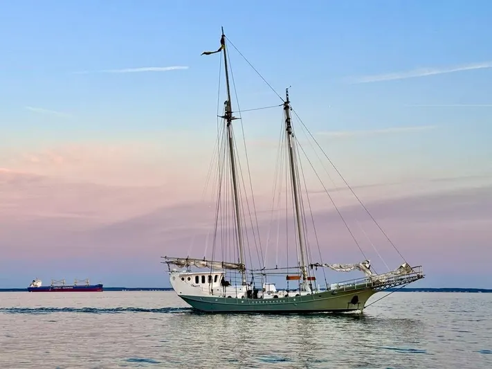 Dauntless Yacht Photos Pics Sailing ship on calm sea at sunset, 1990 custom model.