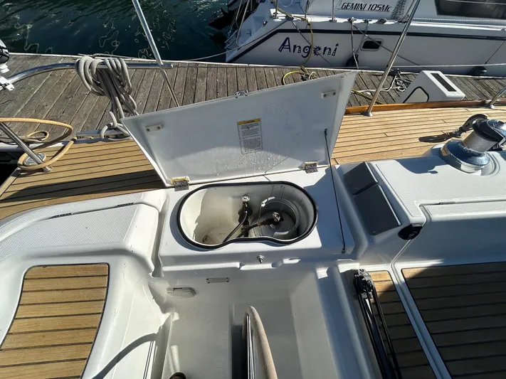 Veronese Yacht Photos Pics Beneteau First 47.7 yacht deck with open storage compartment, 2003 model.