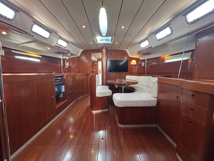 Veronese Yacht Photos Pics Luxurious interior of 2003 Beneteau First 47.7 yacht with polished wood and modern amenities.