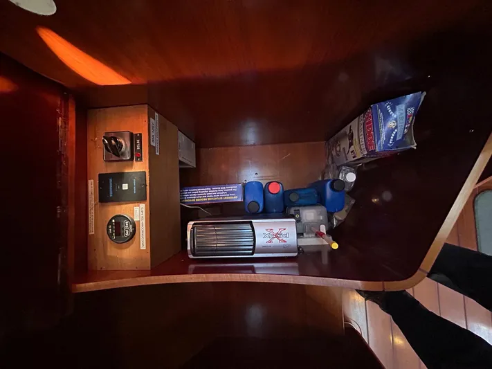Veronese Yacht Photos Pics Storage compartment in a 2003 Beneteau First 47.7 yacht with various equipment.