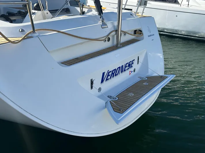 Veronese Yacht Photos Pics Beneteau First 47.7 yacht stern with teak swim platform, 2003 model.