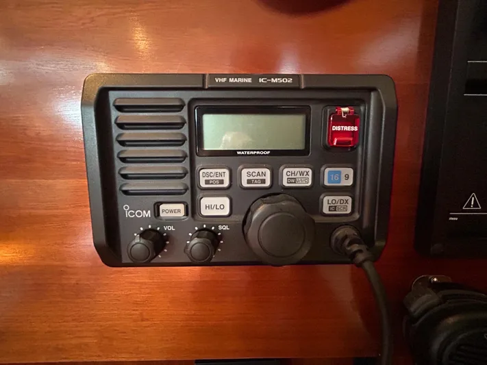 Veronese Yacht Photos Pics VHF marine radio on 2003 Beneteau First 47.7 yacht, featuring distress button and control knobs.