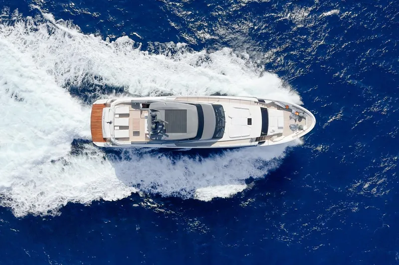 Le Gypsy Yacht Photos Pics Aerial view of 2018 Sanlorenzo 102A yacht cruising on blue ocean waters.